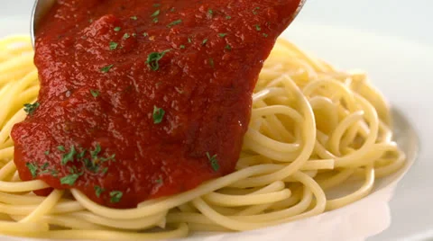 Putting tomato sauce on spaghetti, Slow Motion Stock Footage 31819258