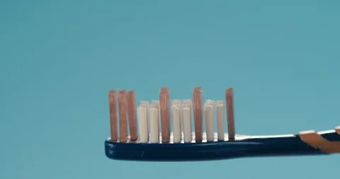 Putting on too much toothpaste on a brush Stock Footage 116606180