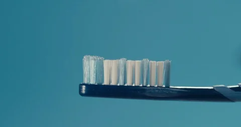 Putting toothpaste on a brush Stock Footage 116606201