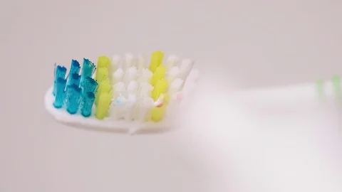Putting toothpaste on brush slow motion close  Stock Footage 73431166