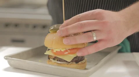 Putting A Toothpick Through Burger Stock Footage 41960945