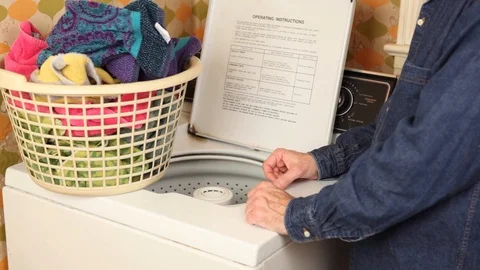 Putting Towels in Washing Machine Stock Footage 126724759
