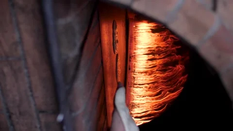 Putting traditional Arabic bread to bake inside a fire oven. Stock Footage 200775665
