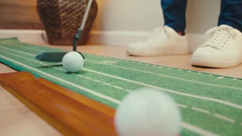 Putting Trainer Slow Motion Multiple Balls Putter White Sneakers Wicker Basket Stock Footage 334475274