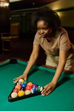 Putting triangular rack on ball pyramid Fotos de archivo