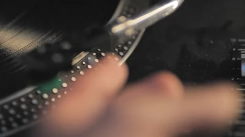 Putting turntable arm on vinyl record dusty black gramophone Stock Footage 244739612