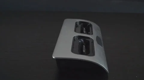 Putting Two Smartphones Into A Dock Side-Shot Stock Footage 35770022