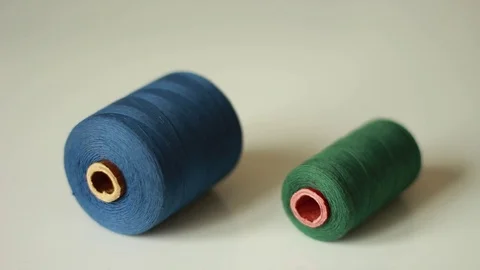 Putting two thread coils Vídeos de archivo 76039381