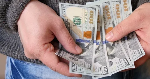 Putting US Dollars in a pocket 스톡 동영상 103093932