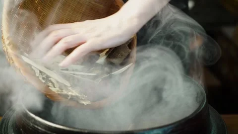 Putting Various Medicinal Herbs into Pot Stock Footage 334167641
