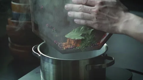 Putting Various Spices into Boiling Water Stock Footage 334171882