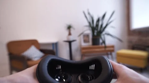 Putting on VR glasses Virtual Reality point of view taking of VR glasses Stock Footage 104702734