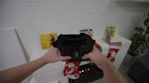 Putting on VR glasses Virtual Reality point of view taking of VR glasses Stock Footage 145150324