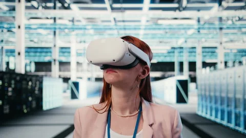 Putting VR goggles on, hardware and female technician in server room Stock Footage 330031097