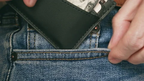 Putting a Wallet in the Pocket Stock Footage 145092283
