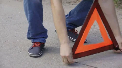 Putting a warning triangle Stock Footage 69167124