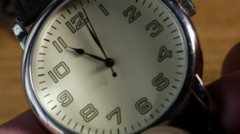 Putting watch back 1 hour, 4K, UHD Stock Footage 48824903