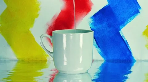 Putting water in a cup Stock Footage 68374728