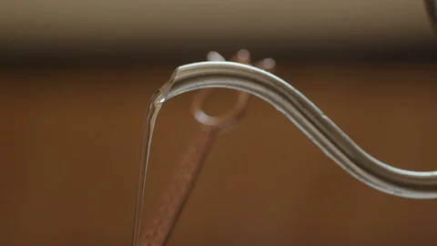Putting water in kettle, 4k slow motion Stock Footage 98881659
