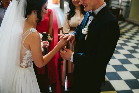 Putting the wedding ring on Stock Photos
