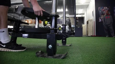 Putting weight on a weight sled 스톡 동영상 68677314