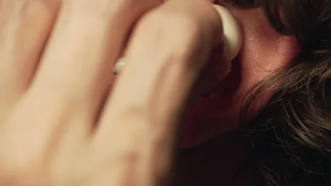 Putting White Earphone In Ear Stock Footage 157899255