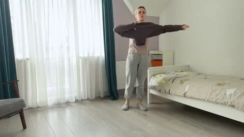 Putting On Wool Sweater At Home Cozy Lifestyle Video stock 344248415