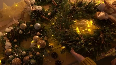 Putting xmas wreath,on table, top view Stock Footage 75942160