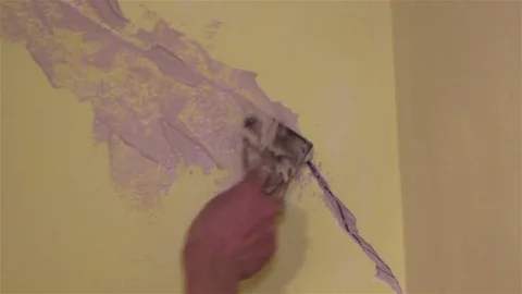 Putty the cracks Stock Footage 71341637