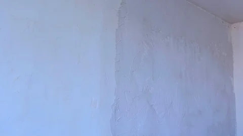 Putty wall aligning with plaster, renovation construction works and overhaul. Stock Footage 123779987