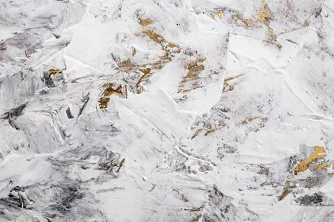 Putty white paste mixed with black ink, abstract close up detail of spatula.. Foto stock