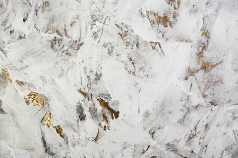 Putty white paste mixed with black ink, abstract close up detail of spatula.. Stock Photos