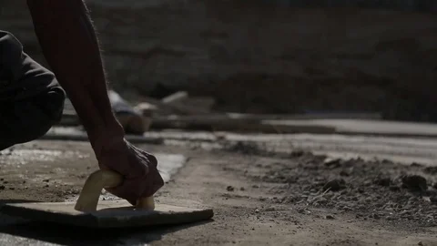 Puttying floor with a putty knife Stock Footage 73420539