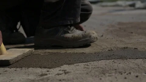 Puttying floor with a putty knife Stock Footage 73420609