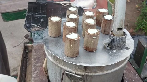 A putu cake seller in Central Java, Indonesia with traditional characteristics Stock Footage 258562624