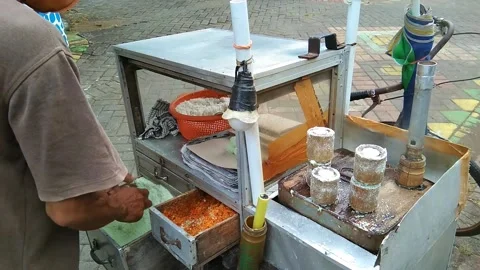 Putu cake traders Stock Footage 219850969