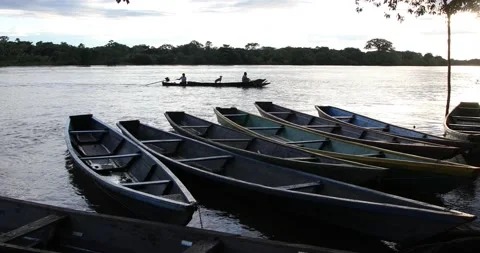 Putumayo river in colombian amazon, with a passing boat Stock Footage 140312643