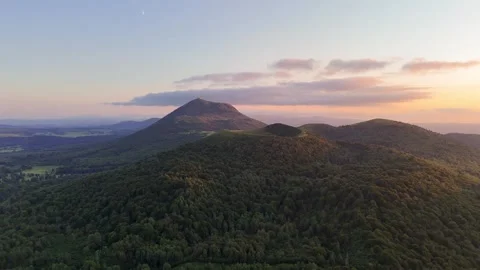 Puy-de-Dôme mountain and Puy de Pariou volcan at sunset during summer Video stock 297470787