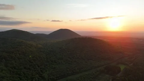 Puy-de-Dôme mountain and Puy de Pariou volcan at sunset during summer Video stock 297470792