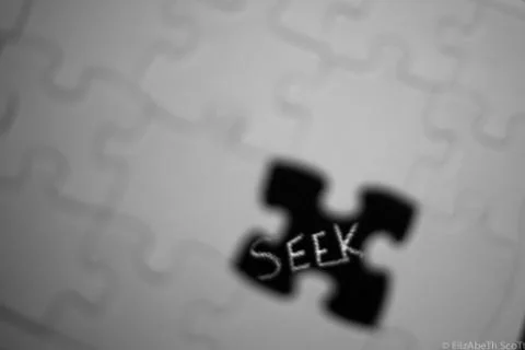 Puzzle Abstract with Puzzle Piece Missing with Word “Seek” Stock Photos