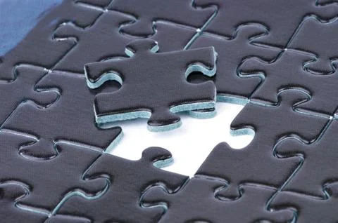 Puzzle background with one piece missing Stock Photos