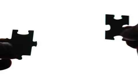 Puzzle in hands isolated on white background Stock Footage 104168918