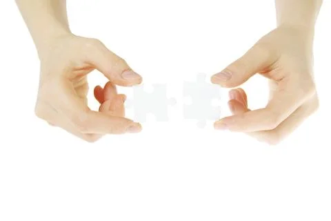 Puzzle in hands Stock-Fotos