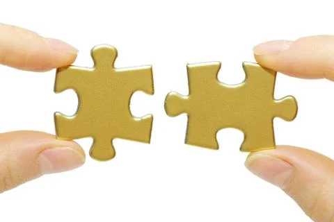 Puzzle in hands Stock Photos