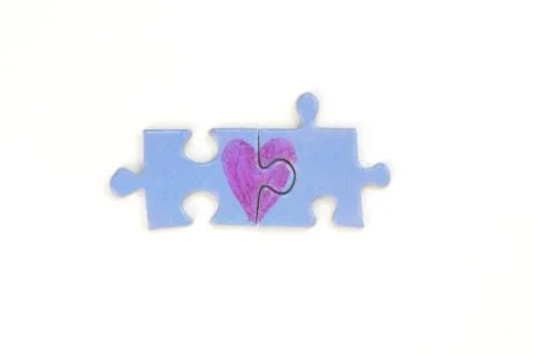 Puzzle with a heart on the withe background. Stock Photos