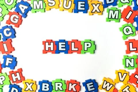 Puzzle HELP on white background Stock Photos