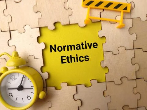 A puzzle layout highlights Normative Ethics in yellow text with a yellow cl.. Stockfoto's