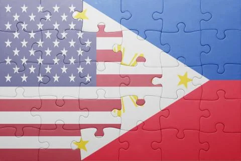 Puzzle with the national flag of united states of america and philippines Stock Photos