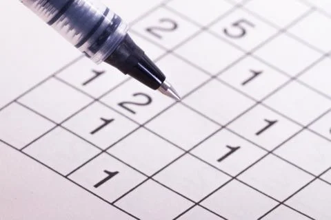 Puzzle with numbers and pen Stock Photos