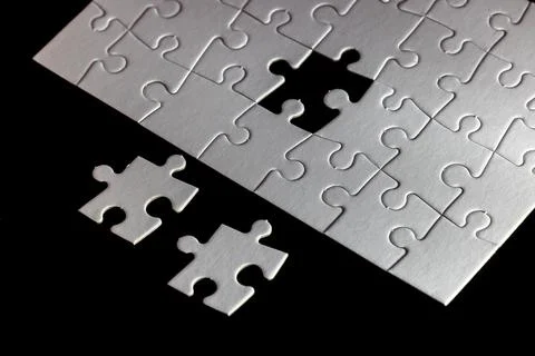 A puzzle piece is missing from a puzzle Stock Photos